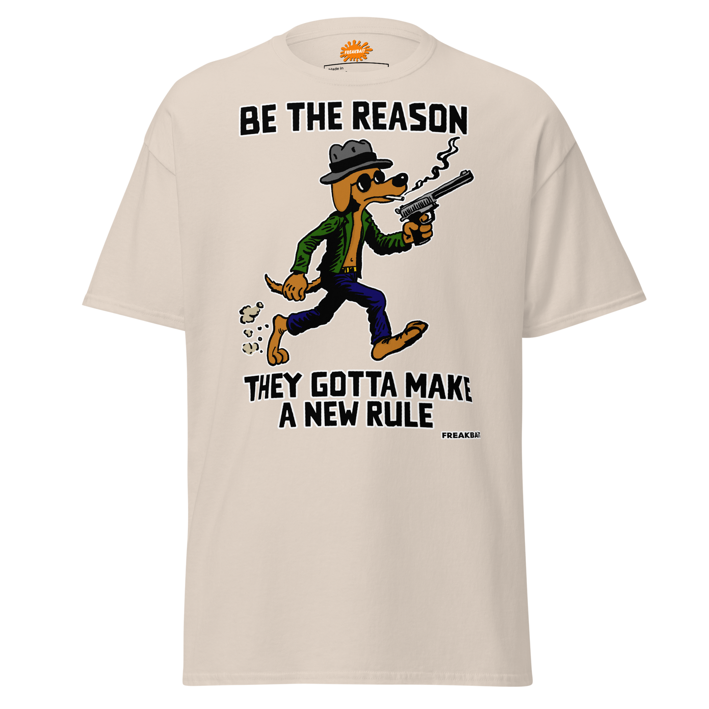 A white crew neck t-shirt with a graphic print of a cartoon character on the front, accompanied by the text 'BE THE REASON' and 'GOTTA MAKE A NEW RULE'.